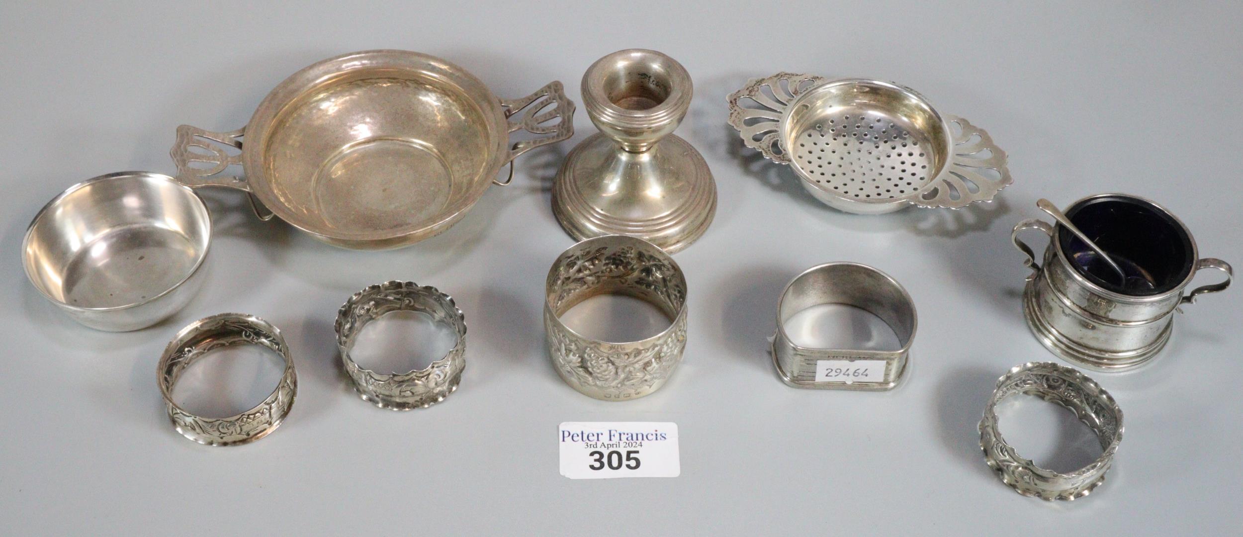 Collection of mainly silver items to include: beaten design Tastvin, various napkin rings, bowl,