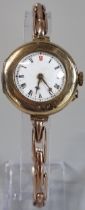 Vintage 9ct gold ladies wristwatch with Roman white enamel face on expanding probably plated