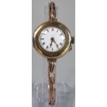 Vintage 9ct gold ladies wristwatch with Roman white enamel face on expanding probably plated