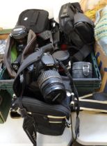 Box of cameras and accessories to include: digital camera in original box, various camera bags,