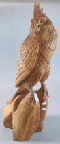 Large hand carved wooden study of a Cockatoo on a naturalistic base. 69cm high approx. (B.P. 21% +