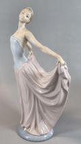 Lladro Spanish porcelain figurine of a dancer with long flowing dress and tiara. 31cm high