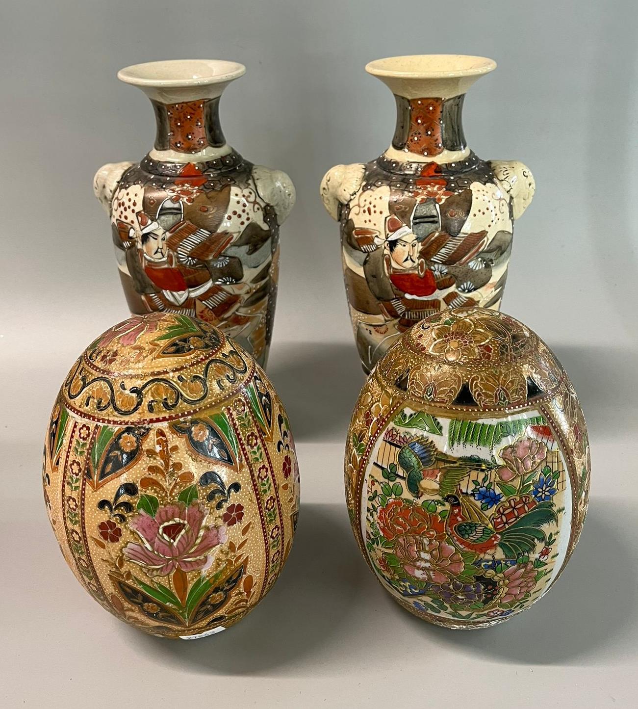 Two Chinese style polychrome ceramic eggs together wit ha pair of Japanese Kyoto Satsuma figural