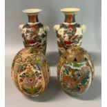 Two Chinese style polychrome ceramic eggs together wit ha pair of Japanese Kyoto Satsuma figural