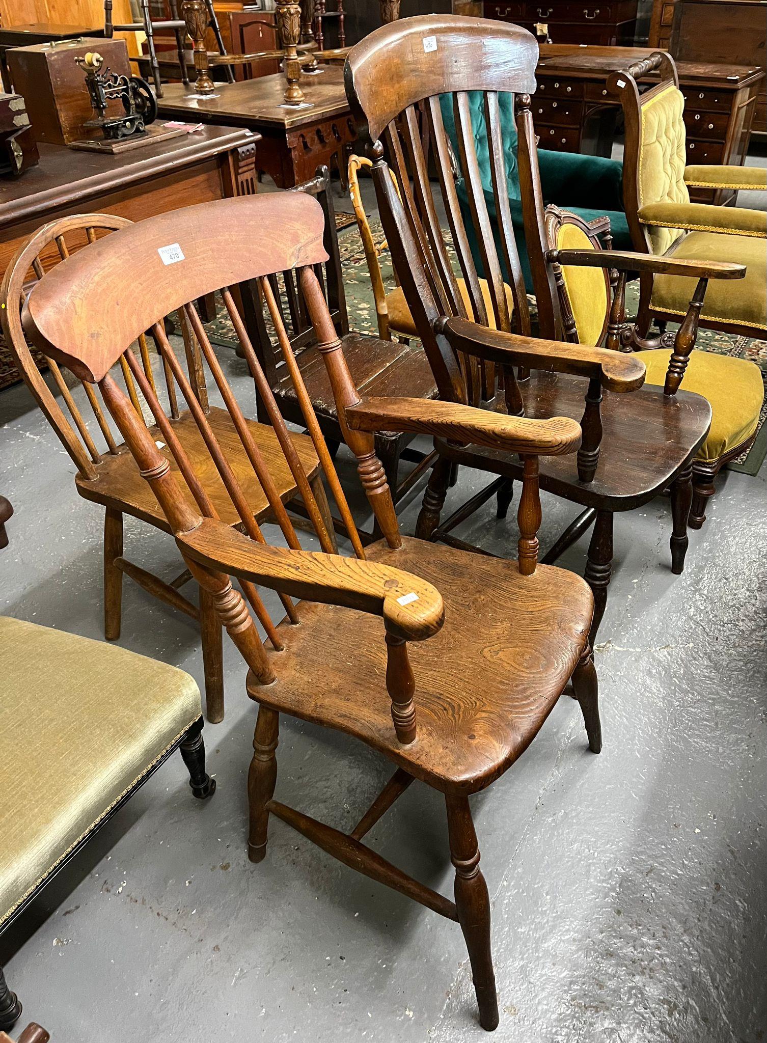 Collection of chairs to include: two similar elm and beech spindle and slat back farmhouse carver