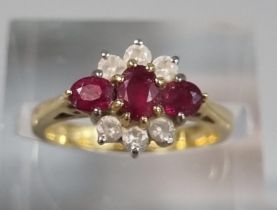 18ct gold nine stone diamond and ruby ring. 3.8g approx. Size J. (B.P. 21% + VAT)