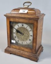 20th century oak cased mantle clock with brass face and silvered chapter ring. (B.P. 21% + VAT)