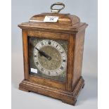20th century oak cased mantle clock with brass face and silvered chapter ring. (B.P. 21% + VAT)