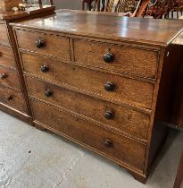 19th century oak straight front cock beaded chest of two short and three long drawers with turned