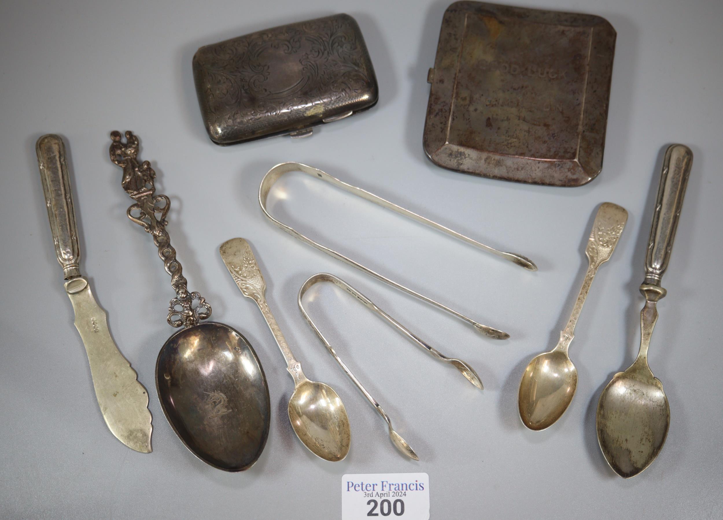 Collection of silver and silver plated items to include: cigarette case, sugar nips, spoons,