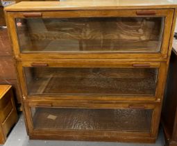 Art Deco design light oak Globe Wernicke style sectional bookcase with Bakelite handles.