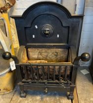 Cast Iron dog grate with arched lion mask back and fire brick lined basket with ash drawer below.