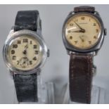Garrard mid century silver presentation wristwatch with Arabic face having seconds dial on leather
