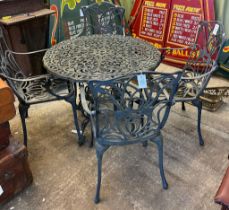 Cast metal Art Nouveau design circular garden table with four elbow chairs. (5) (B.P. 21% + VAT)