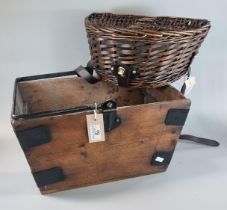 Modern wicker fishing creel together with a rustic pine and metal mounted trug with swing handle. (