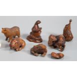 Collection of Japanese carved boxwood netsukes to include: frogs, carp, wild boar, snake, elephant