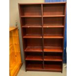 Group of four pine finish and mahogany finish open bookshelves of different sizes and heights, all