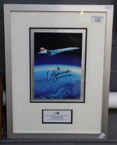 Framed and signed photograph, 'Concorde from Concorde', together with a miniature solid cast