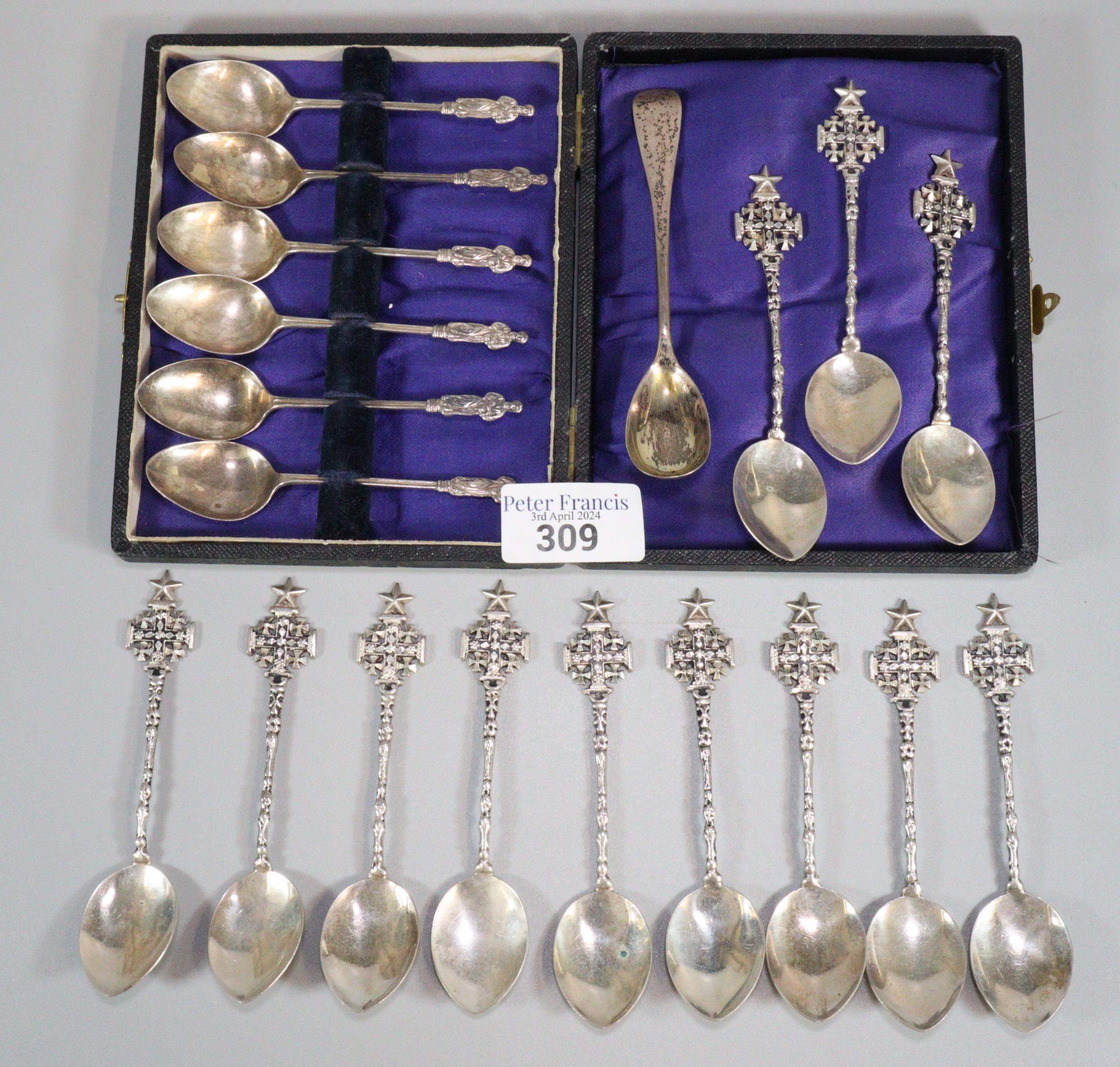Set of twelve Jerusalem teaspoons together with a silver spoon and a cased set of six Apostle spoons