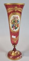 19th century, probably Bohemian cranberry glass trumpet shaped vase, with gilt floral and foliate