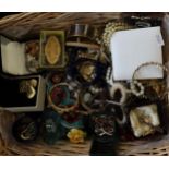 Wicker basket of various jewellery to include: pearls, brooches, necklaces, bangles, bracelets