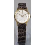 Omega 9ct gold ladies wristwatch, having satin face with baton numerals and leather strap. Weight