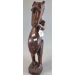 Carved African hardwood fertility figurine. 51cm high approx. (B.P. 21% + VAT)