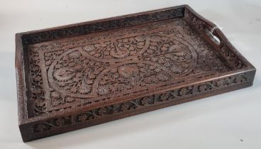 Indian hardwood ornately carved floral and foliate two handled tray with hand holes. (B.P. 21% +