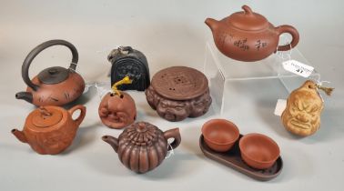 Mixed group of Yixing style Zisha clay pottery teapots, tea bowls and stand. (9) (B.P. 21% + VAT)