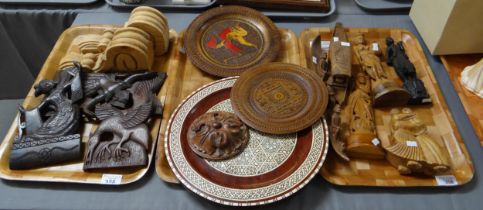 Three trays of carved wooden South East Asian items to include: exotic birds, boats etc, together