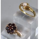 9ct gold garnet cluster flower head ring. 2.9g approx. Ring Size M. Together with a dress ring. (