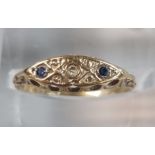 9ct gold and sapphire ring with small diamond chip. 0.8g approx. Size K. (B.P. 21% + VAT)