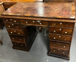 19th century rosewood kneehole desk, the leather and moulded top above a bank of five drawers to