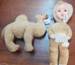 Vintage mohair soft toy camel together with a mid century doll with celluloid face and rolling
