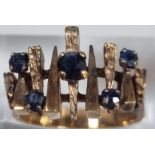 9ct gold modernist design and blue stone dress ring. 5g approx. Size K1/2. (B.P. 21% + VAT)