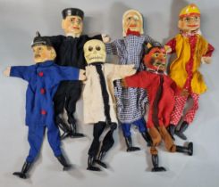 Collection of vintage wooden and fabric hand puppets to include: skeleton, devil, Punch etc. (6) (