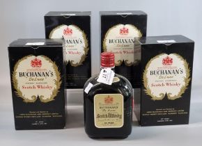 Five bottles of Buchanan's 'De Luxe' Finest Blended Scotch Whisky. 70% proof 26 2/3 ozs. Four with