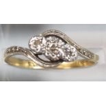 18ct gold and platinum twist shank three stone diamond ring. 2.4g approx. Size L1/2. (B.P. 21% +