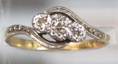 18ct gold and platinum twist shank three stone diamond ring. 2.4g approx. Size L1/2. (B.P. 21% +