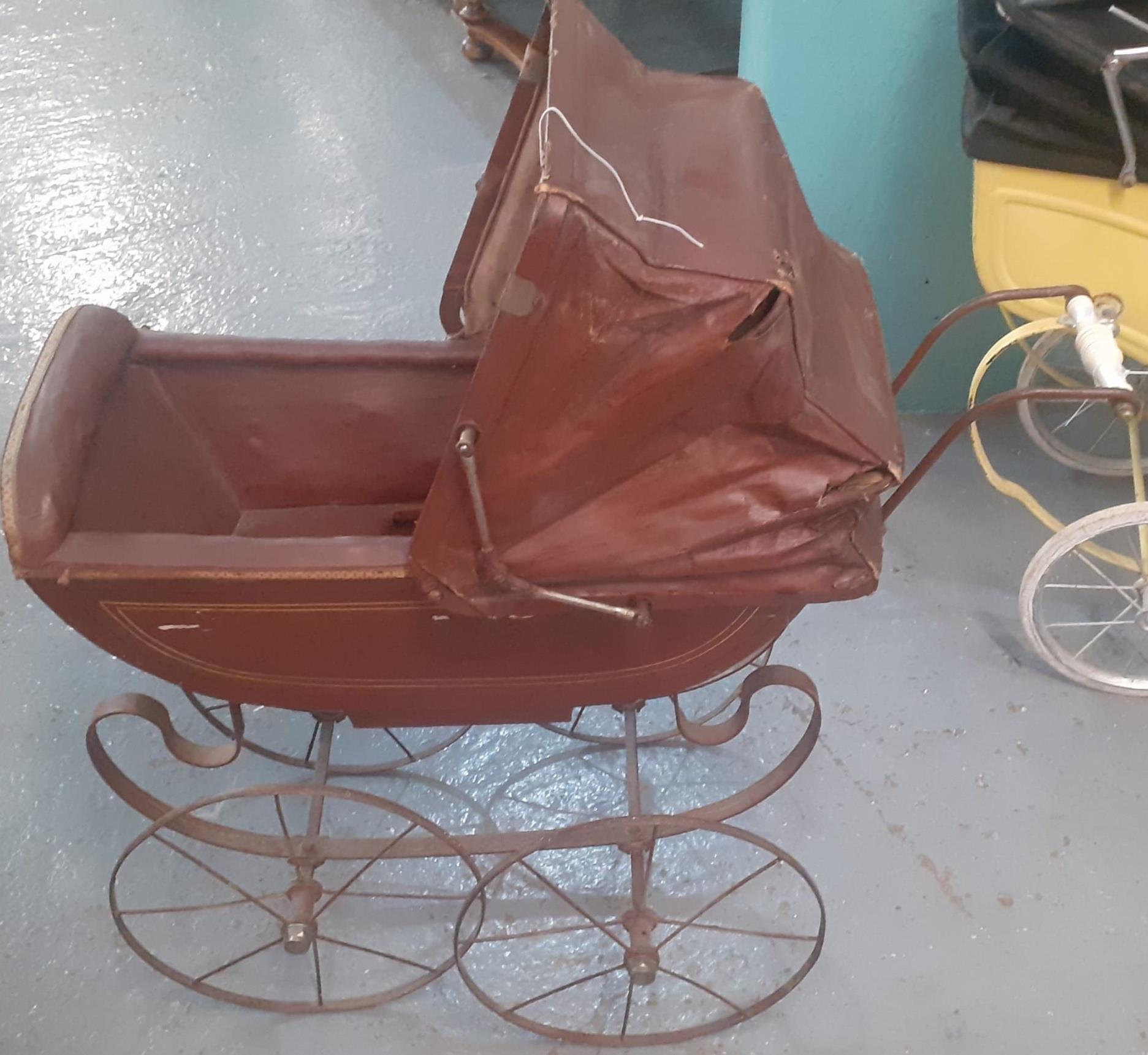 Late Victorian/Edwardian doll's pram with folding canvas canopy, ceramic handle and sprung frame