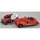 Two vintage Schuco clockwork tinplate classic cars to include: Kommando Anno 2000 and Examico