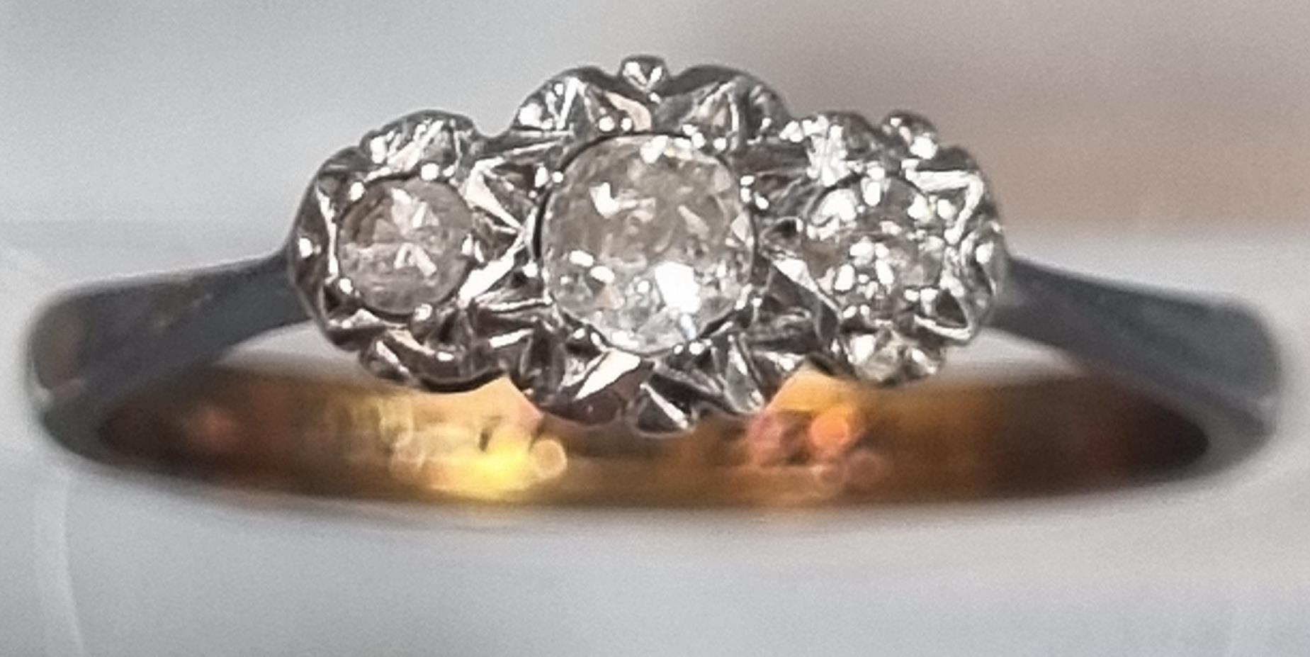 9ct gold three stone diamond ring. 1.4g approx. Size K1/2. (B.P. 21% + VAT)