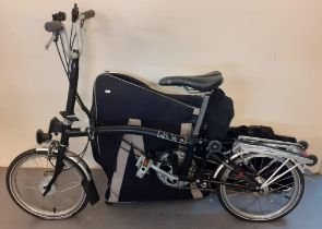 Brompton folding bicycle in textile bag together with additional Brompton textile bag. (B.P. 21% +