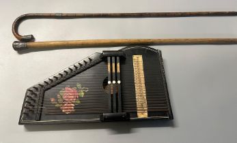 Early 20th century German Zither with floral decoration together with a malacca cane walking stick