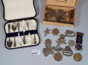 Small wooden cigar box containing assorted Military insignia, a WWI Victory Medal awarded Private