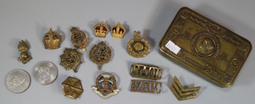 WWI Queen Mary's Brass tobacco box containing an assortment of military cap badges and other