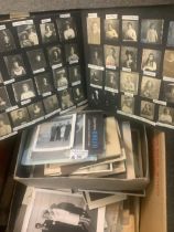 Box of old photographs in various albums and loose, mostly black and white family photos. 100s. (B.