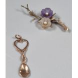 9ct rose gold love spoon charm (possibly Clogau). 1.4g approx. Together with 9ct gold floral and