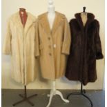 Three vintage ladies fur coats to include: a white musquash fur, a blonde harp seal fur coat by A.