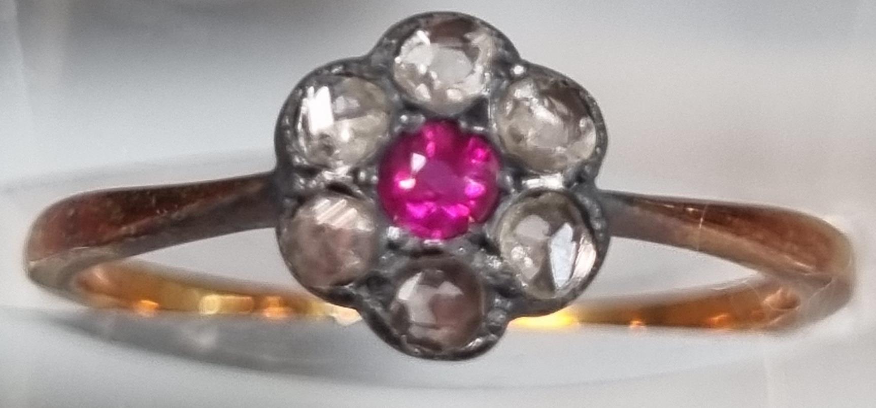 18ct gold diamond and ruby daisy ring. 2g approx. Size M1/2. (B.P. 21% + VAT)